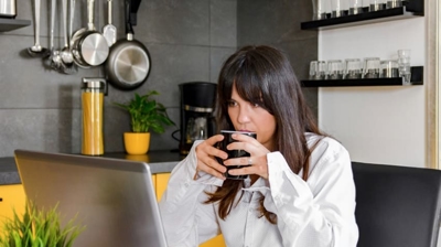 How To Stop My Air Conditioner Freezing Up? a woman drinking