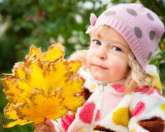 girl with fall leaves