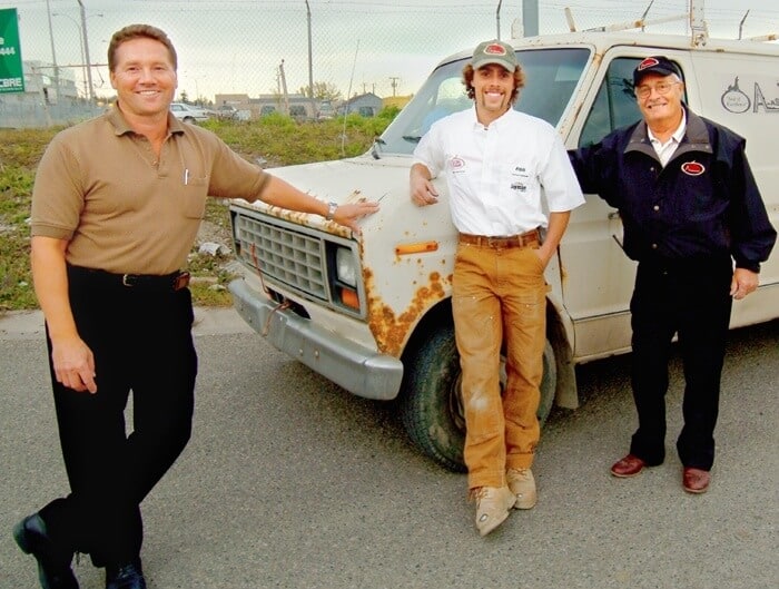 A family business: (l-r) Bernie Wandler, Ryan Wandler, and Tony Hinger. “Rusty” the van is the oldest surviving van at Knight.