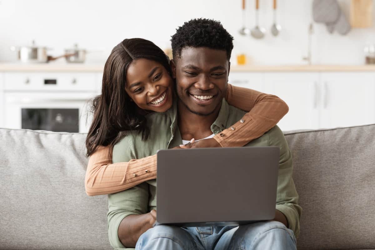 Couple on a computer searching what a SEER rating is
