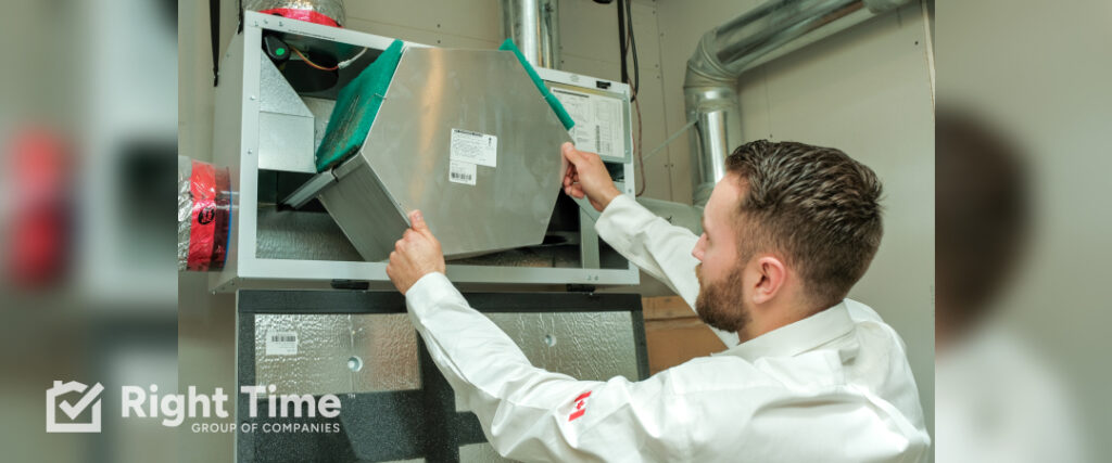 HVAC technician in Calgary inspecting and adjusting MERV rating filters in residential HVAC system equipment to optimize air quality and system performance.