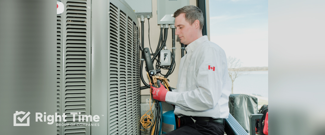 Technician checking refrigerant gauges and connections on an outdoor central air conditioner during a “not cooling” service call in Calgary.